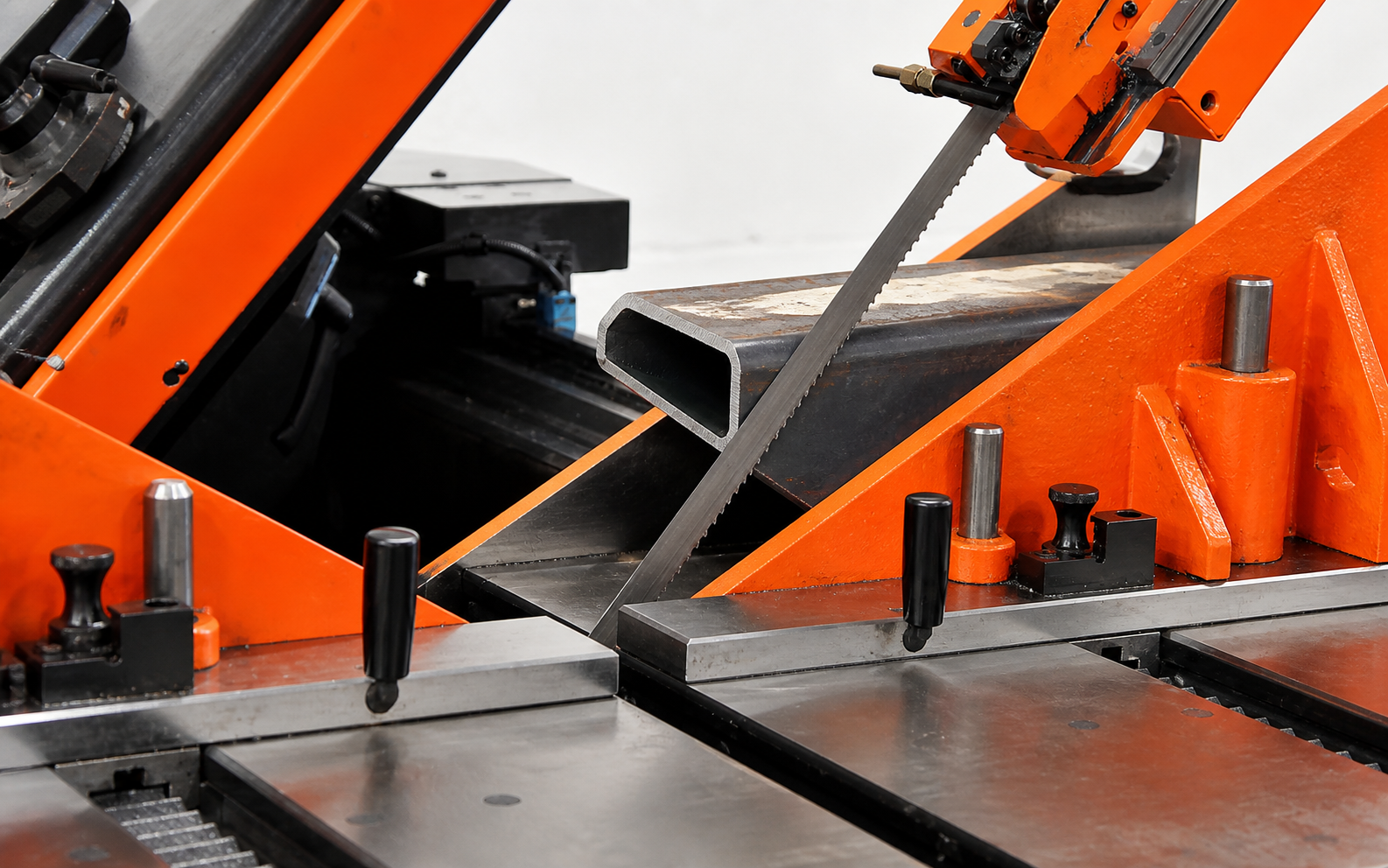 Cut steel round, square and rectangular sections in a production sawing workshop